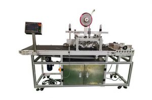 Automatic tape sticking machine